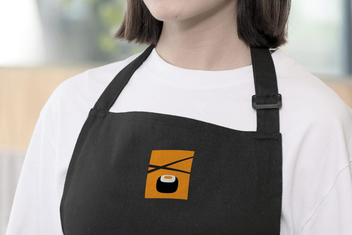 Brand presentation on apron for Japanese sushi restaurant in Cleveland Ohio Kenko teriyaki by freelance graphic designer Rick Martin