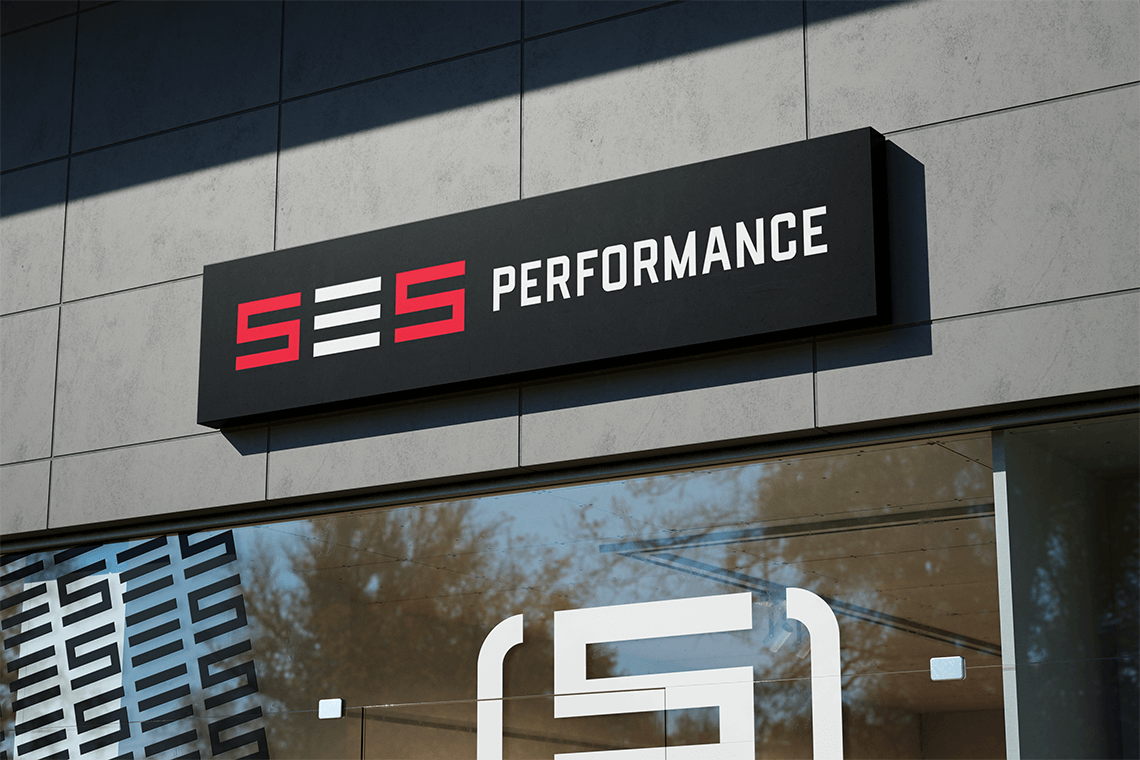 storefront signage and window graphic design for premier athlete fitness and wellness personal trainer brand SES by freelance graphic designer Rick Martin