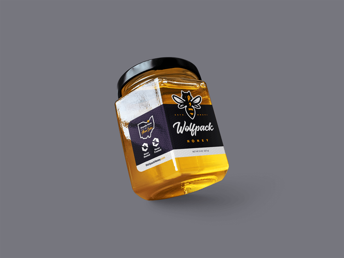 Packaging design and label for dynamic bold modern local Ohio honey company Wolfpack Honey by freelance graphic designer and illustrator Rick Martin